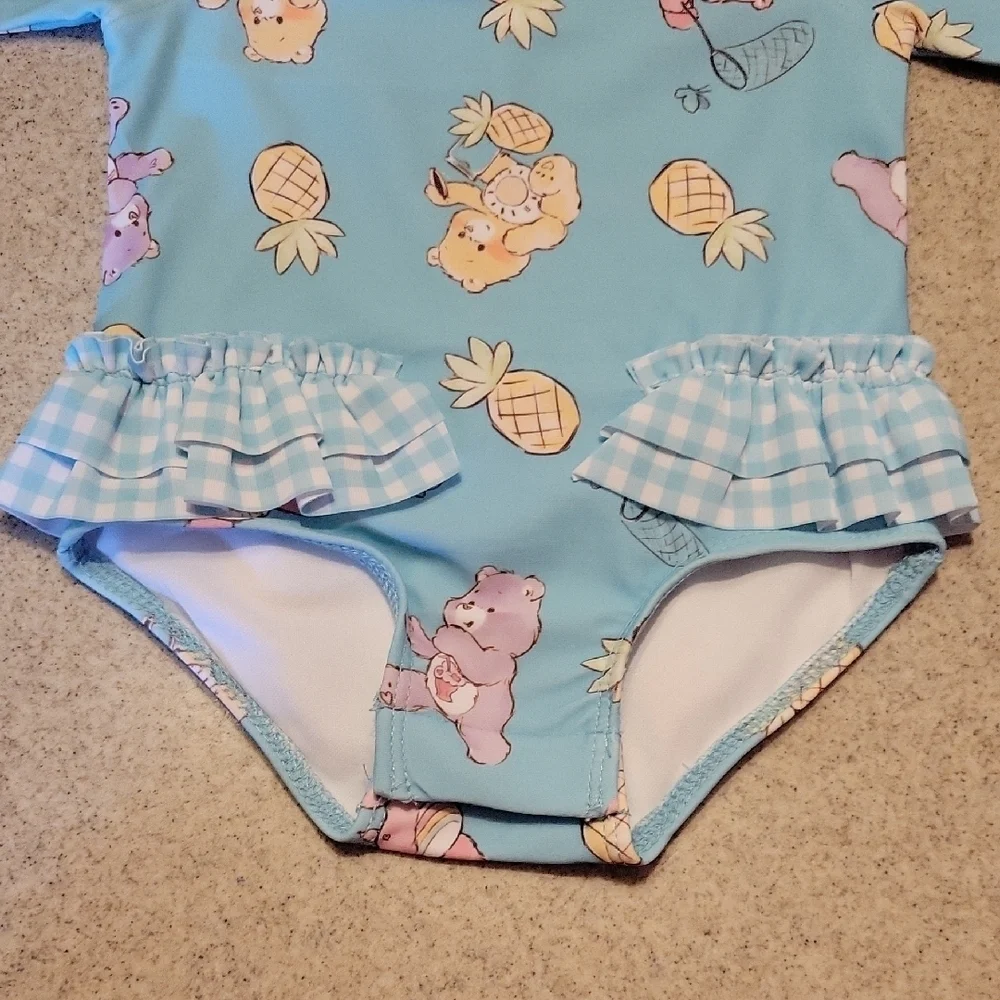 Care BearsOne Piece Swim Rashguard SIZE 3-6 months Nwt